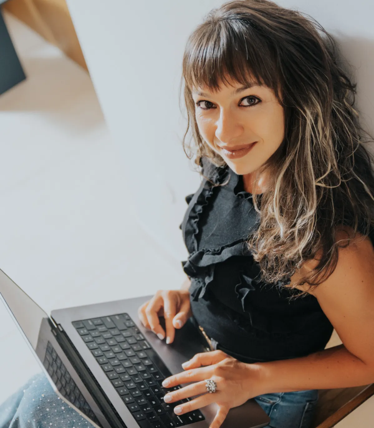 Marchela, founder of Wealthy Nomads, at work